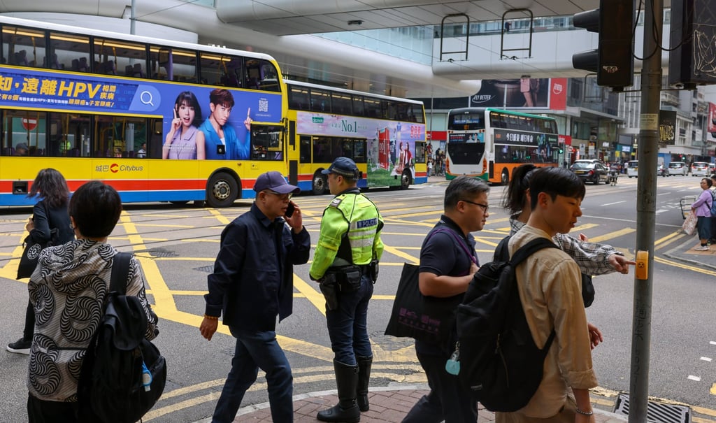 A policeman carries out a road safety operation in Central in March. Photo: Nora Tam