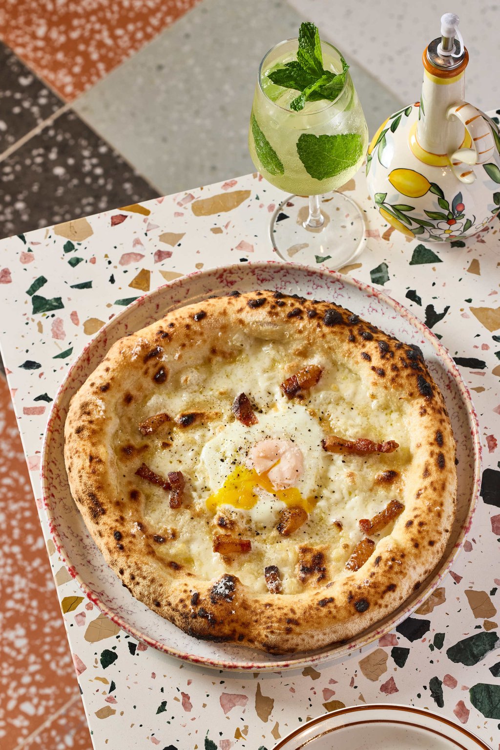Fugazzi’s Carbonara pizza, with fior di latte, guanciale, egg yolk and pecorino romano. Photo: courtesy Fugazzi Fugazzi’s Carbonara pizza, with fior di latte, guanciale, egg yolk and pecorino romano. Photo: courtesy Fugazzi