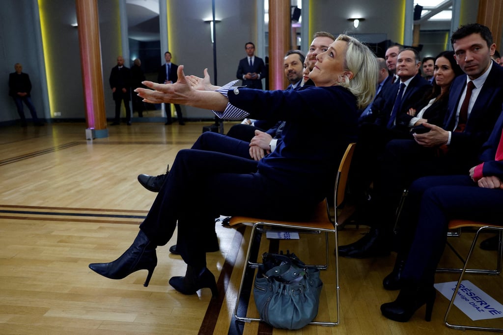 Far-right political party leader and French MP Marine Le Pen reacts when Jordan Bardella (not pictured) gives his New Year's address to journalists in Paris 2025. Photo: Reuters