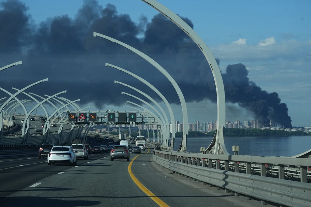 A plume of black smoke is seen over the port of St Petersburg, Russia, on Wednesday after a Ukrainian drone attack. Photo: AP