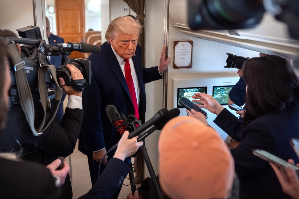 President Donald Trump regularly clashes with the media. Here he is speaking to reporters aboard Air Force One on Friday. Photo: AP