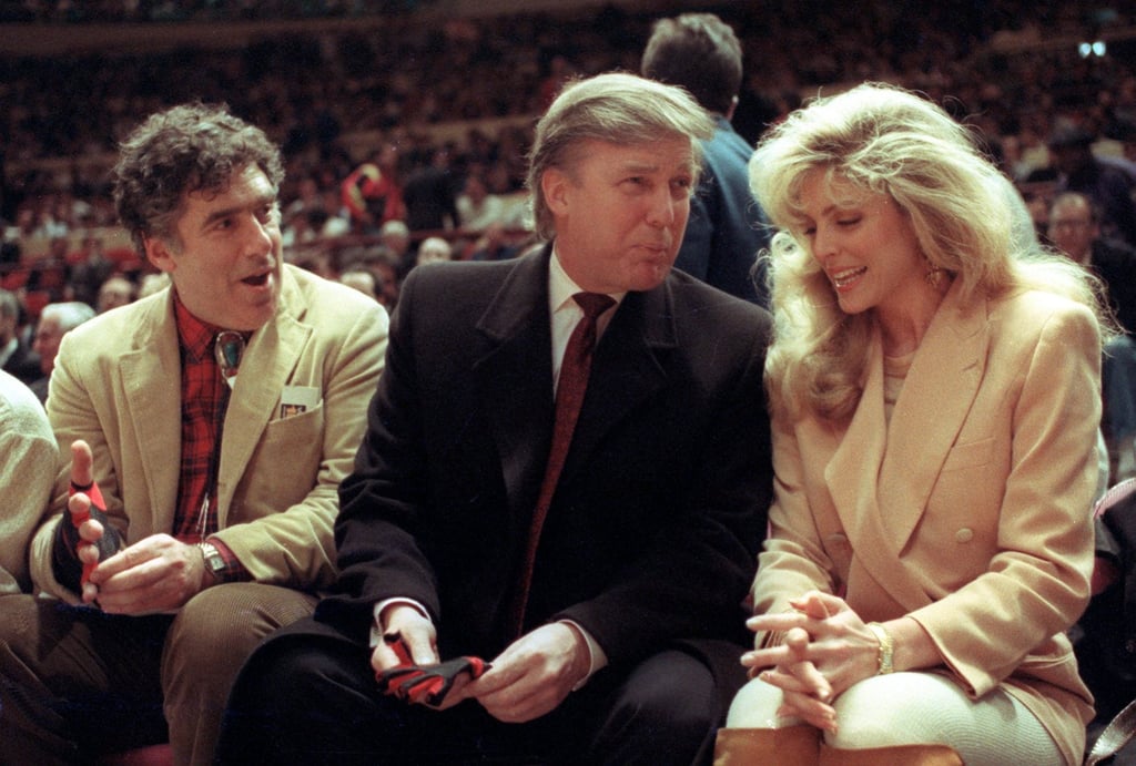 Donald Trump, ex-wife Marla Maples and actor Elliott Gould (left) sit courtside at a Knicks game at Madison Square Garden in 1991. Photo: AP Donald Trump, ex-wife Marla Maples and actor Elliott Gould (left) sit courtside at a Knicks game at Madison Square Garden in 1991. Photo: AP