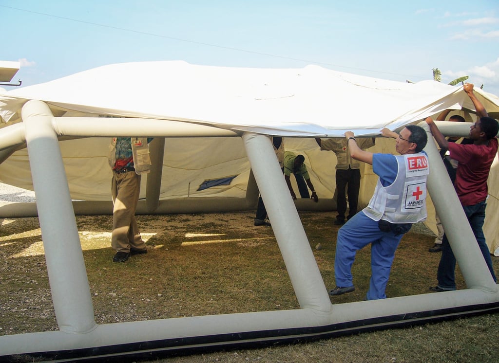 Luke Tsang helps erect a tent in Haiti, 2010. Photo: courtesy Luke Tsang Luke Tsang helps erect a tent in Haiti, 2010. Photo: courtesy Luke Tsang