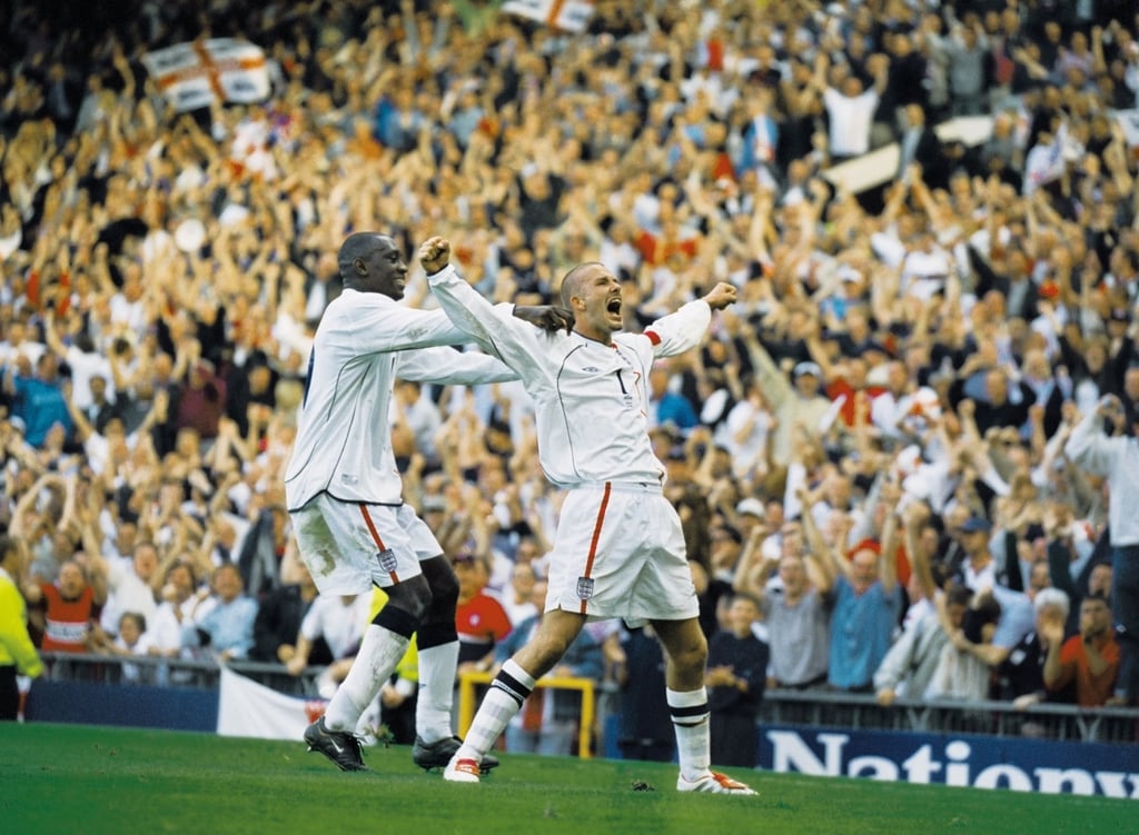 David Beckham of England celebrates his late equalising goal with teammate Emile Heskey, during the World Cup group qualifier against Greece in Manchester, England, in 2001. England sealed qualification after the game ended 2-2. Photo: Allsport David Beckham of England celebrates his late equalising goal with teammate Emile Heskey, during the World Cup group qualifier against Greece in Manchester, England, in 2001. England sealed qualification after the game ended 2-2. Photo: Allsport