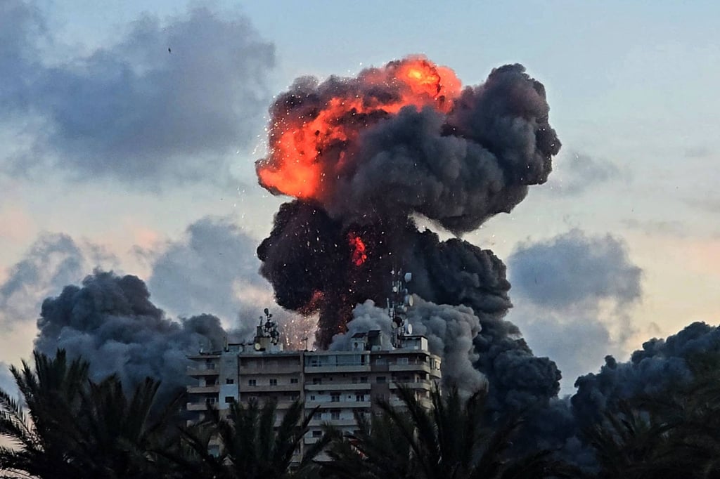 A fireball and smoke erupt from a building following an Israeli strike in Tyre, southern Lebanon, on May 28. Photo: AFP A fireball and smoke erupt from a building following an Israeli strike in Tyre, southern Lebanon, on May 28. Photo: AFP