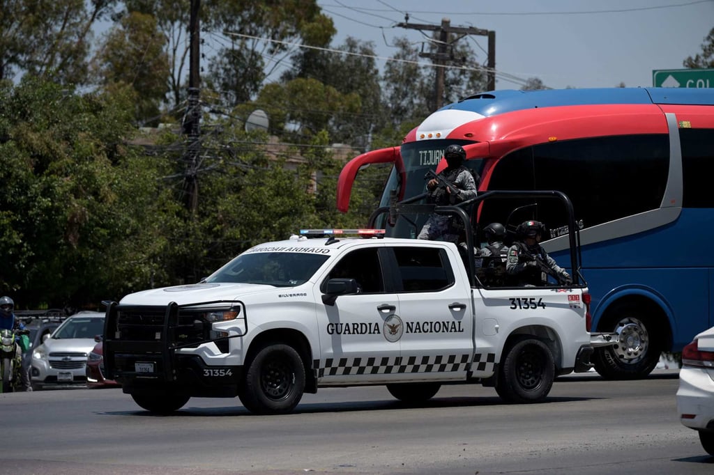 Mexico’s National Guard escort the bus transporting the Iran team after a training session in Tijuana. Photo: AFP Mexico’s National Guard escort the bus transporting the Iran team after a training session in Tijuana. Photo: AFP