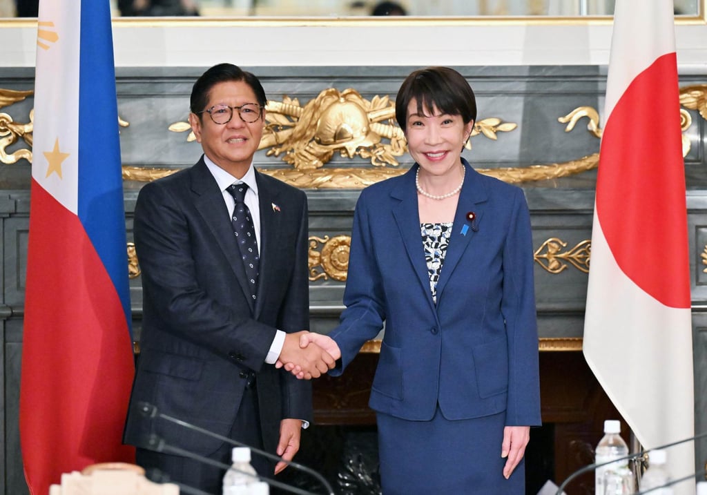 Japanese Prime Minister Sanae Takaichi (right) and Philippine President Ferdinand Marcos Jnr (left) shake hands before talks in Tokyo on May 28. Photo: Kyodo