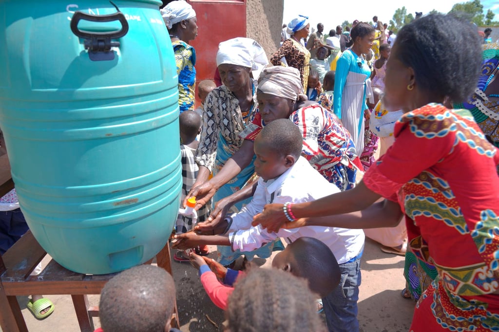 Villagers wash their hands as a preventive measure against Ebola after attending a church service in Rwanpara, Ituri, the Democratic Republic of the Congo, on Sunday. Photo: EPA Villagers wash their hands as a preventive measure against Ebola after attending a church service in Rwanpara, Ituri, the Democratic Republic of the Congo, on Sunday. Photo: EPA
