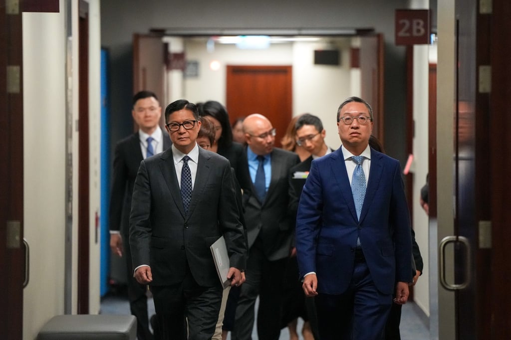 (From left) Hong Kong Secretary for Security Chris Tang Ping-keung and Secretary for Justice Paul Lam Ting-kwok meet the media at the Legislative Council Complex on June 8, as the government proposed legislation to clarify the definition of national security offences. Photo: Sam Tsang