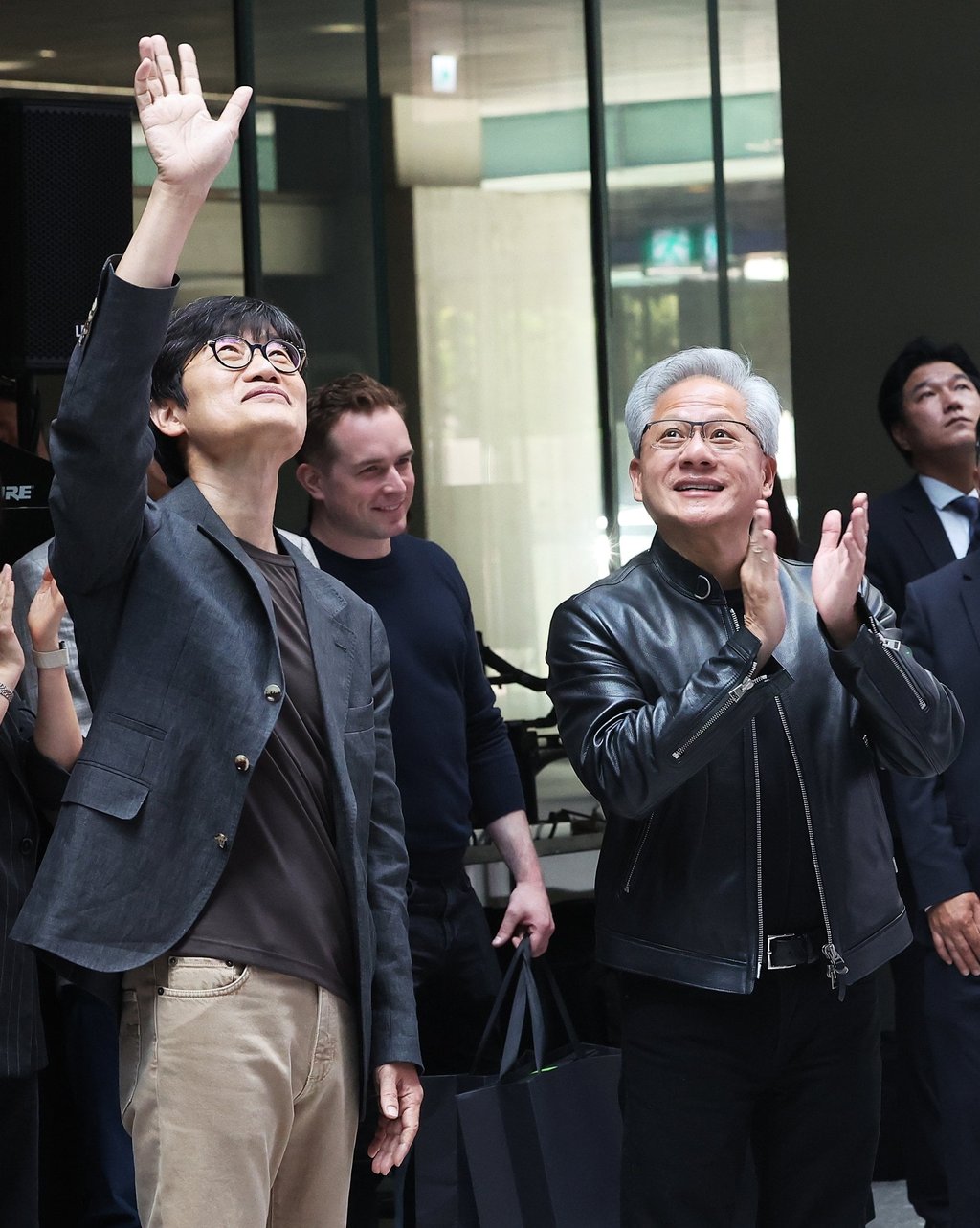Nvidia CEO Jensen Huang (right) and Lee Hae-jin, founder of internet giant Naver, acknowledge visitors during their meeting at the Naver headquarters in Seongnam, south of Seoul, on Monday. Photo: Yonhap/EPA Nvidia CEO Jensen Huang (right) and Lee Hae-jin, founder of internet giant Naver, acknowledge visitors during their meeting at the Naver headquarters in Seongnam, south of Seoul, on Monday. Photo: Yonhap/EPA