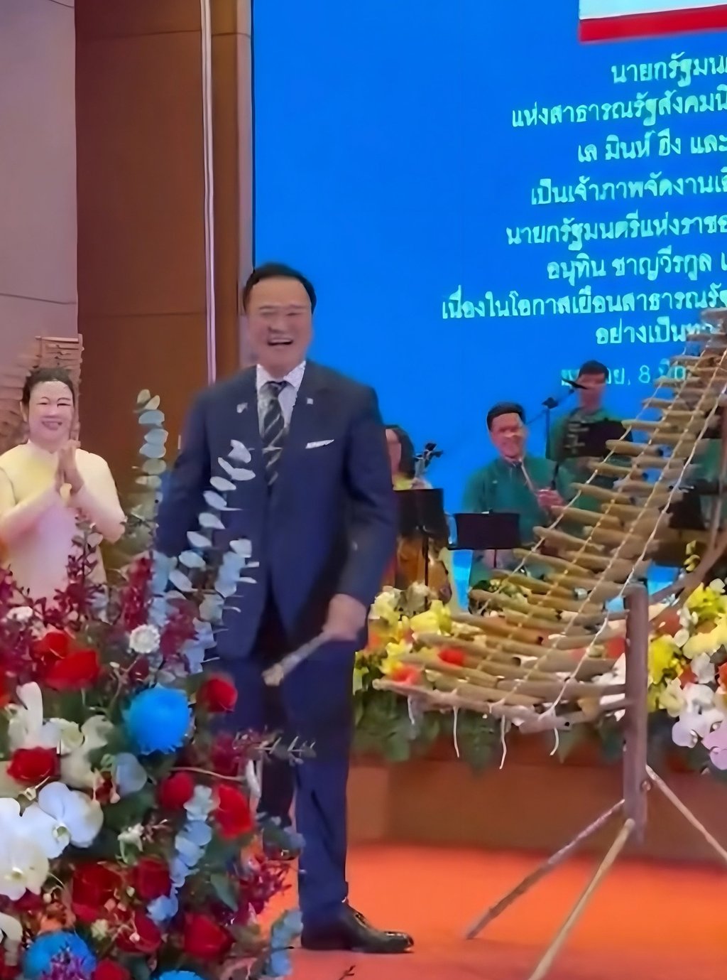 Anutin Charnvirakul smiles after playing a traditional Vietnamese “t’rung” xylophone at a state banquet in Hanoi on Monday in this still from a social media video. Photo: Facebook
