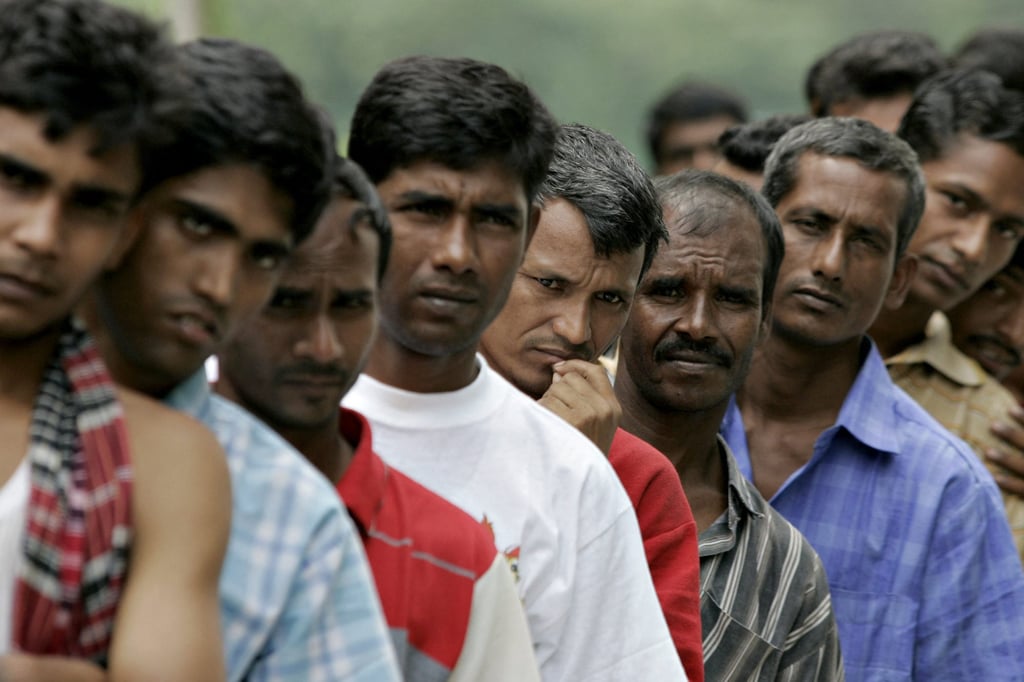 Bangladeshi migrant workers in Malaysia queue for food aid outside the Bangladeshi High Commission in Kuala Lumpur in 2007. Photo: AFP Bangladeshi migrant workers in Malaysia queue for food aid outside the Bangladeshi High Commission in Kuala Lumpur in 2007. Photo: AFP