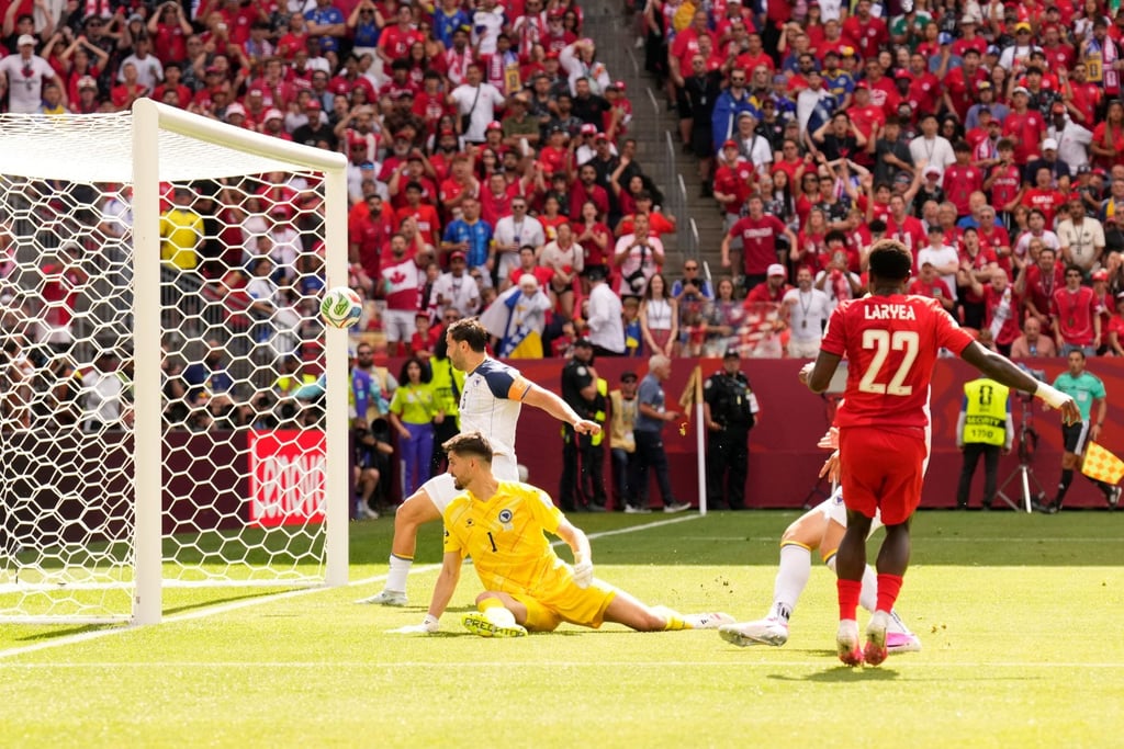 Canada’s Richie Laryea (right) watches as his shot at goal is cleared away off the crossbar by Bosnia’s Sead Kolasinac. Photo: AP Canada’s Richie Laryea (right) watches as his shot at goal is cleared away off the crossbar by Bosnia’s Sead Kolasinac. Photo: AP