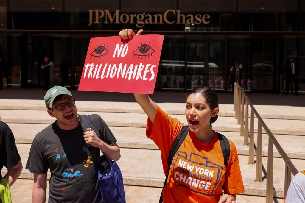 People protest against the SpaceX IPO in New York on Friday. Photo: EPA People protest against the SpaceX IPO in New York on Friday. Photo: EPA
