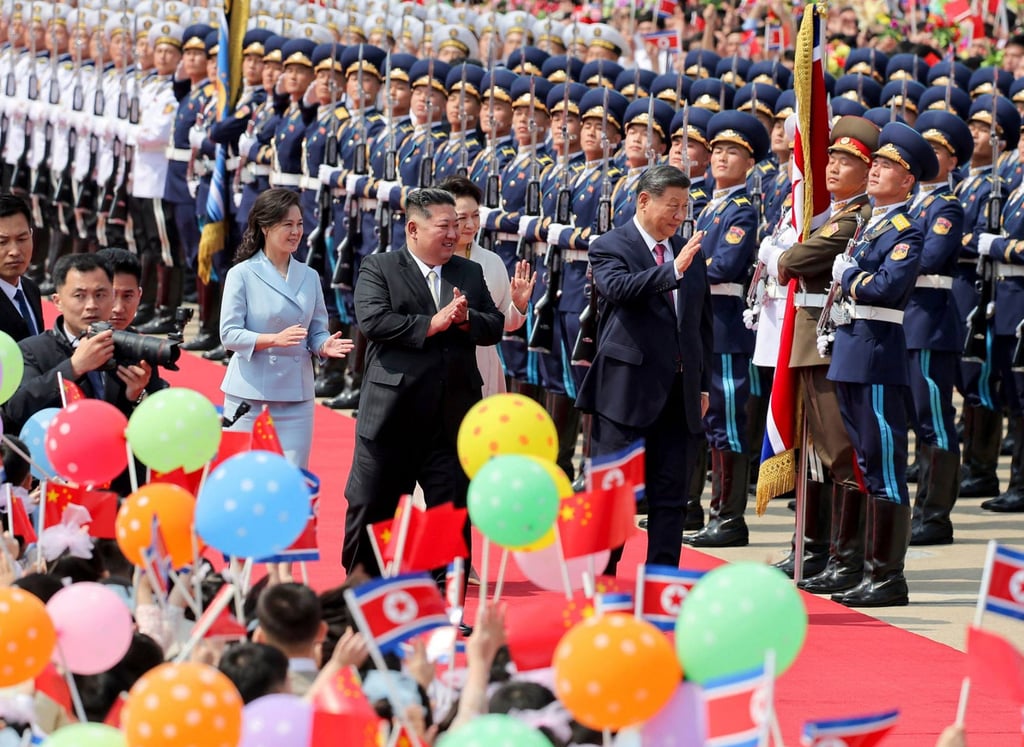North Korean leader Kim Jong-un (centre left) and his wife Ri Sol-ju (left) see off China’s President Xi Jinping (centre right) and his wife Peng Liyuan at Pyongyang International Airport on Tuesday. Photo: KCNA/AFP