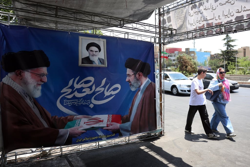 Iranians walk past a poster featuring late Iranian supreme leader Ayatollah Ali Khamenei (left) alongside his son and successor, Supreme Leader Ayatollah Mojtaba Khamenei in Tehran on Thursday. Photo: EPA Iranians walk past a poster featuring late Iranian supreme leader Ayatollah Ali Khamenei (left) alongside his son and successor, Supreme Leader Ayatollah Mojtaba Khamenei in Tehran on Thursday. Photo: EPA
