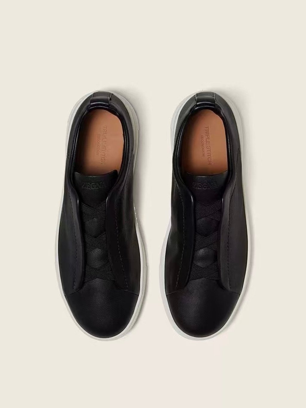 The classic Triple Stitch trainers in black. Photo: Handout The classic Triple Stitch trainers in black. Photo: Handout