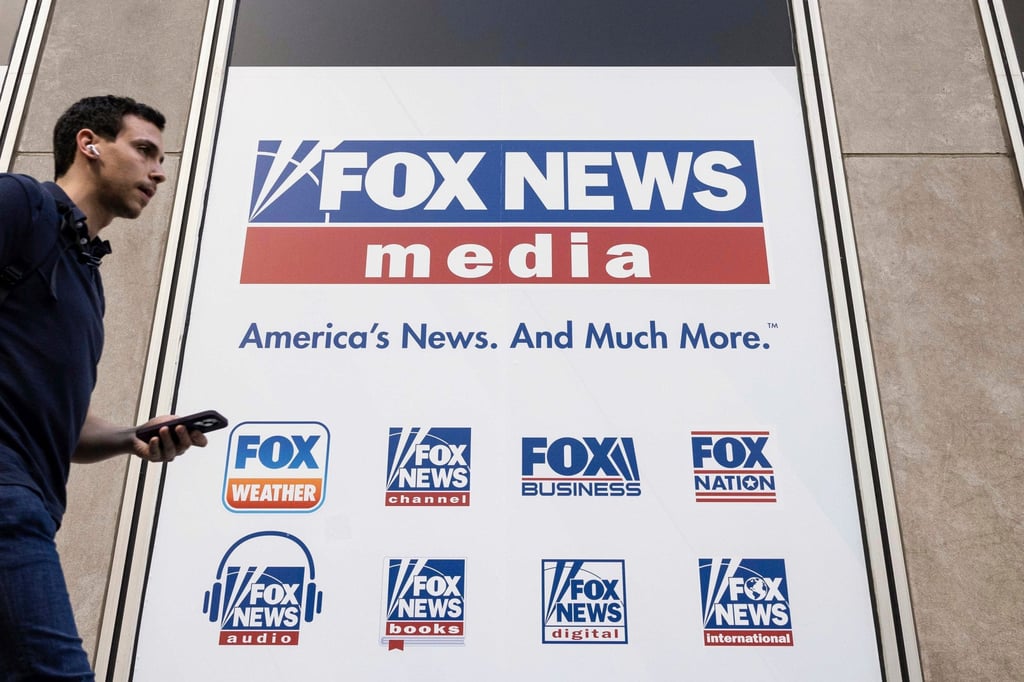 A person walks past the Fox News Headquarters in New York. It is Fox’s first major acquisition since CEO and chairman Lachlan Murdoch cemented control over the media empire. Photo: AP