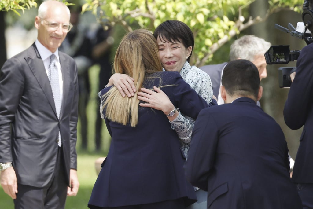 Italian Prime Minister Giorgia Meloni (front) greets her Japanese counterpart Sanae Takaichi before their meeting in Rome on Monday. Photo: Kyodo