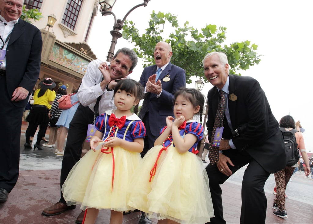 Operation leadership team members pose for a photo with twin sisters from Shanghai on the Disneyland theme park’s opening day. Photo: Simon Song Operation leadership team members pose for a photo with twin sisters from Shanghai on the Disneyland theme park’s opening day. Photo: Simon Song