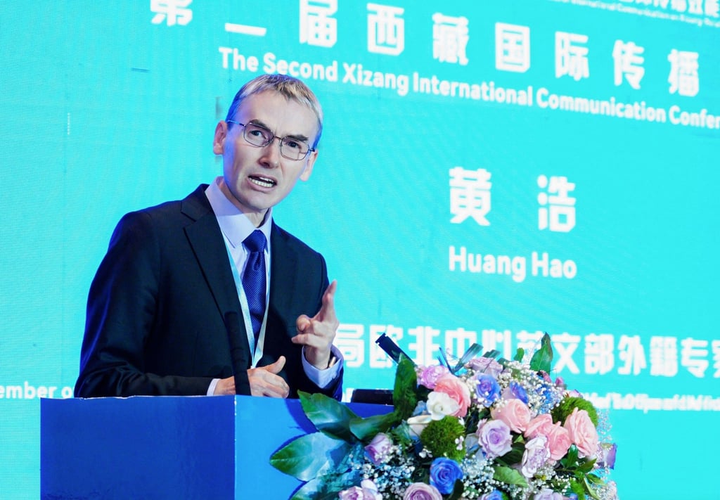 Zachary Lundquist, aka Huang Hao, addresses the symposium in Lhasa on Tuesday. Photo: Handout