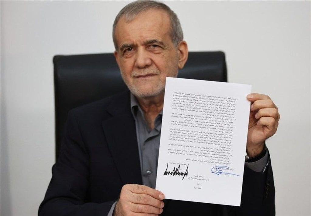 Iranian President Masoud Pezeshkian shows the memorandum of understanding with US president Donald Trump’s signature. Photo: TV IRIB/EPA