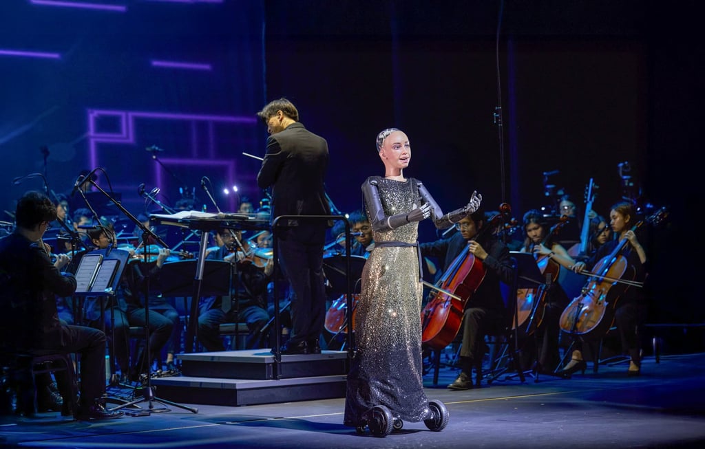 Sophia the robot sings while Poon conducts at an AI-themed concert celebrating the 70th anniversary of the Hong Kong Baptist University. Photo: courtesy HKBU Sophia the robot sings while Poon conducts at an AI-themed concert celebrating the 70th anniversary of the Hong Kong Baptist University. Photo: courtesy HKBU