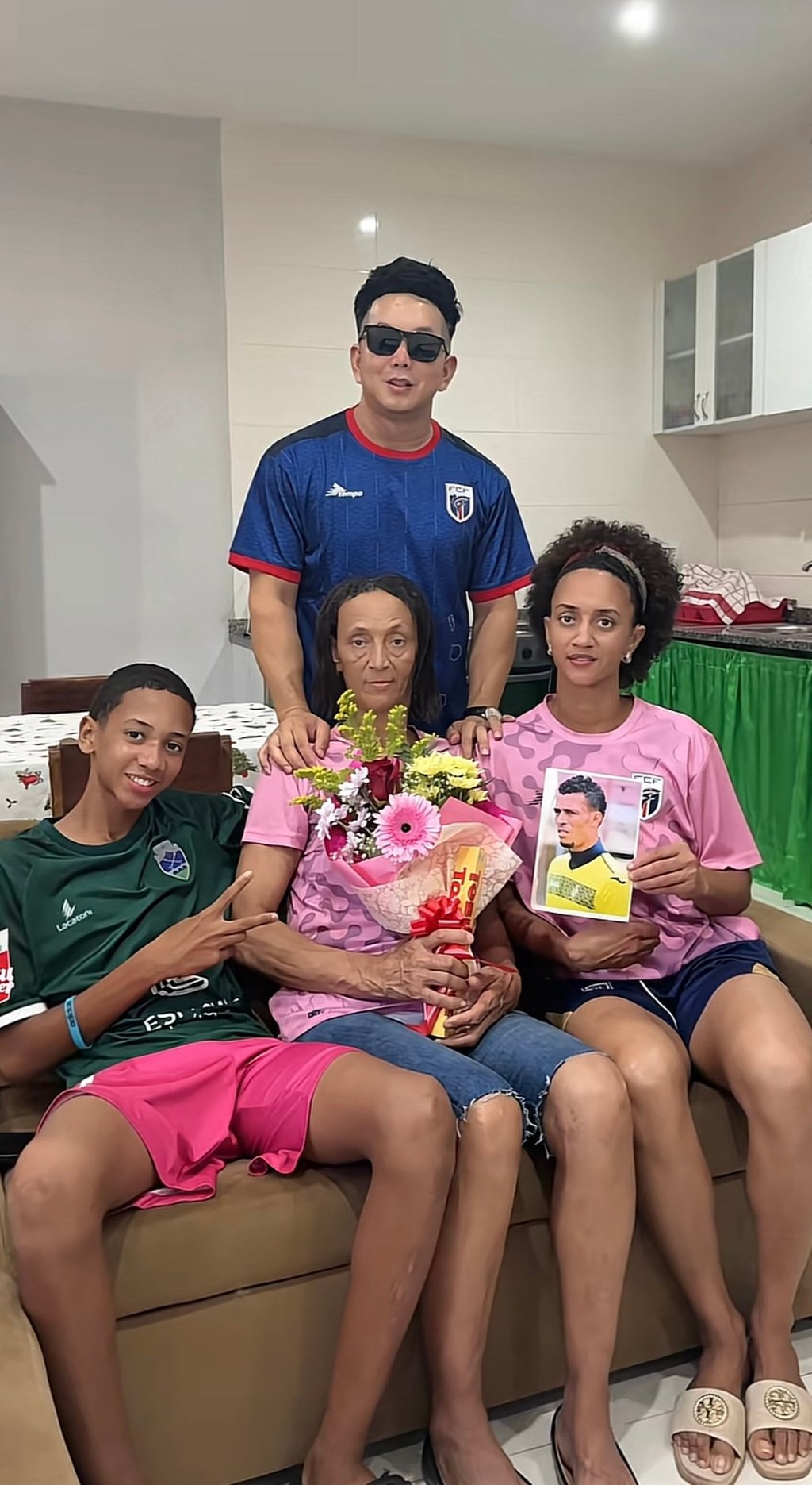Lin Jie (back) poses with the family of Cabo Verde goalkeeper Vozinha, including his mother, Ana Candida Evora, (centre), his nephew and his younger sister (right). Photo: Lin Jie/Douyin Lin Jie (back) poses with the family of Cabo Verde goalkeeper Vozinha, including his mother, Ana Candida Evora, (centre), his nephew and his younger sister (right). Photo: Lin Jie/Douyin