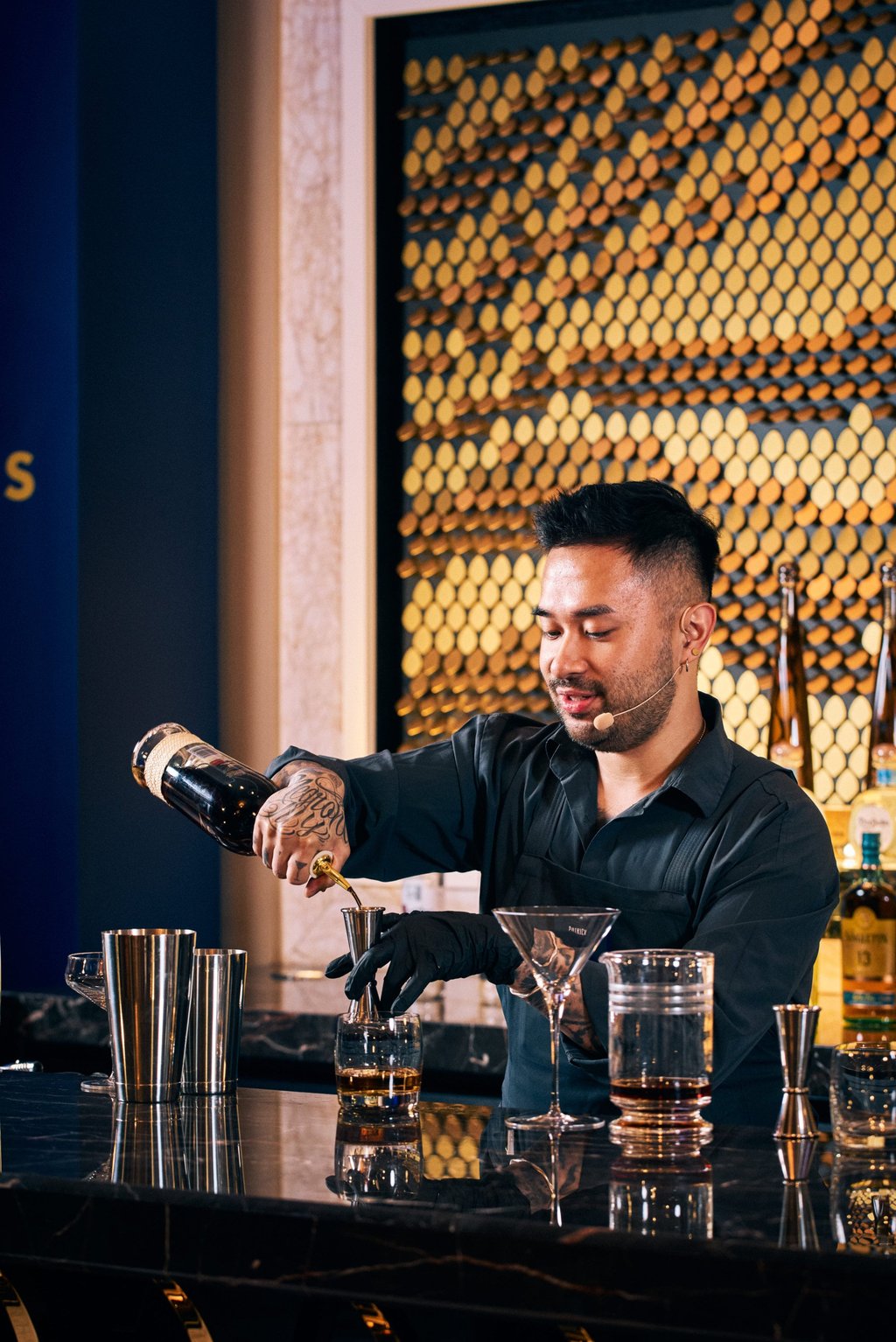 Poon of Mius, with a gloved left hand following an injury, prepares a cocktail during the 2026 Diageo World Class Hong Kong and Macau competition. Photo: Diageo World Class Poon of Mius, with a gloved left hand following an injury, prepares a cocktail during the 2026 Diageo World Class Hong Kong and Macau competition. Photo: Diageo World Class