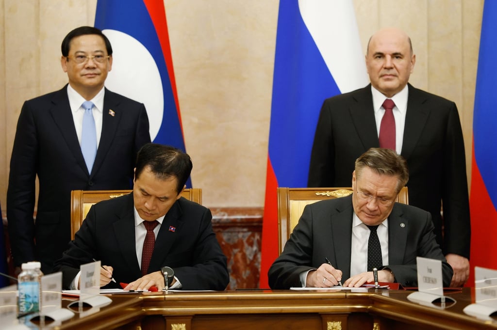 Officials from Laos and Russia sign a nuclear energy cooperation agreement in Moscow on Monday. Photo: EPA Officials from Laos and Russia sign a nuclear energy cooperation agreement in Moscow on Monday. Photo: EPA