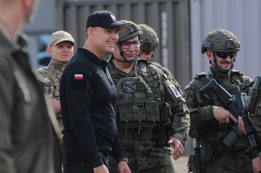 Polish President Karol Nawrocki (in black) visits troops during a training exercise in Orzysz, Poland, on Wednesday. Photo: EPA Polish President Karol Nawrocki (in black) visits troops during a training exercise in Orzysz, Poland, on Wednesday. Photo: EPA