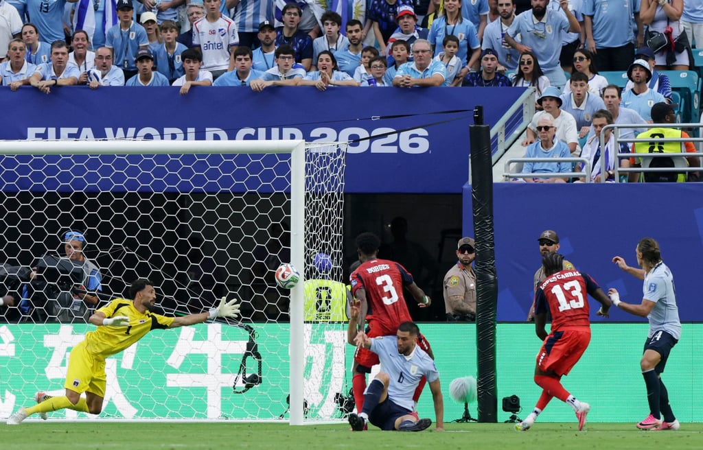 Maxi Araujo of Uruguay scoring the equalizing goal for his team. Photo: Reuters