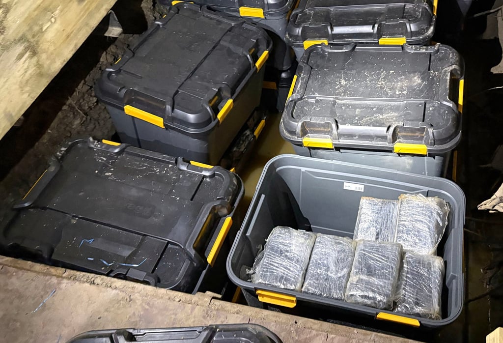 Cocaine is hidden in plastic tubs buried underground on the outskirts of Sydney. Photo: Australian Federal Police/AFP Cocaine is hidden in plastic tubs buried underground on the outskirts of Sydney. Photo: Australian Federal Police/AFP