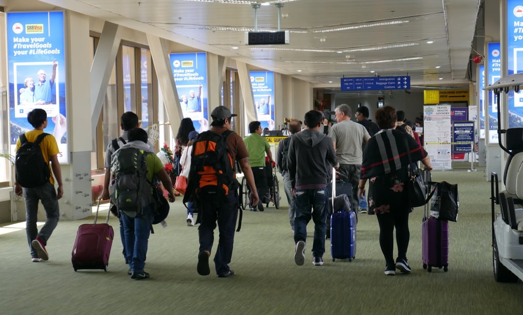 Passengers walk through Ninoy Aquino International Airport in Manila. Photo: Shutterstock Passengers walk through Ninoy Aquino International Airport in Manila. Photo: Shutterstock