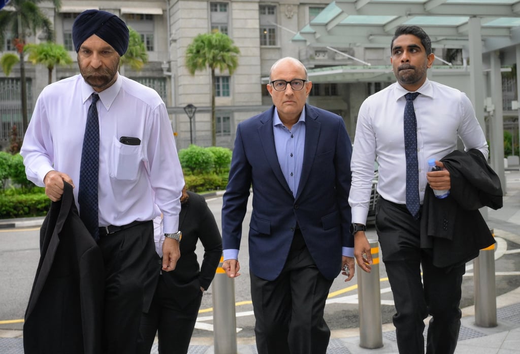 Singapore’s former Transport Minister S. Iswaran (centre) arrives at the State Courts with his legal team on January 18, 2024. Photo: The Straits Times/EPA-EFE Singapore’s former Transport Minister S. Iswaran (centre) arrives at the State Courts with his legal team on January 18, 2024. Photo: The Straits Times/EPA-EFE