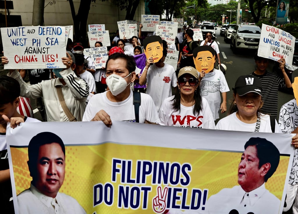 Filipino protesters hold placards during a protest in front of the Chinese embassy in Manila in August last year. Photo: EPA Filipino protesters hold placards during a protest in front of the Chinese embassy in Manila in August last year. Photo: EPA