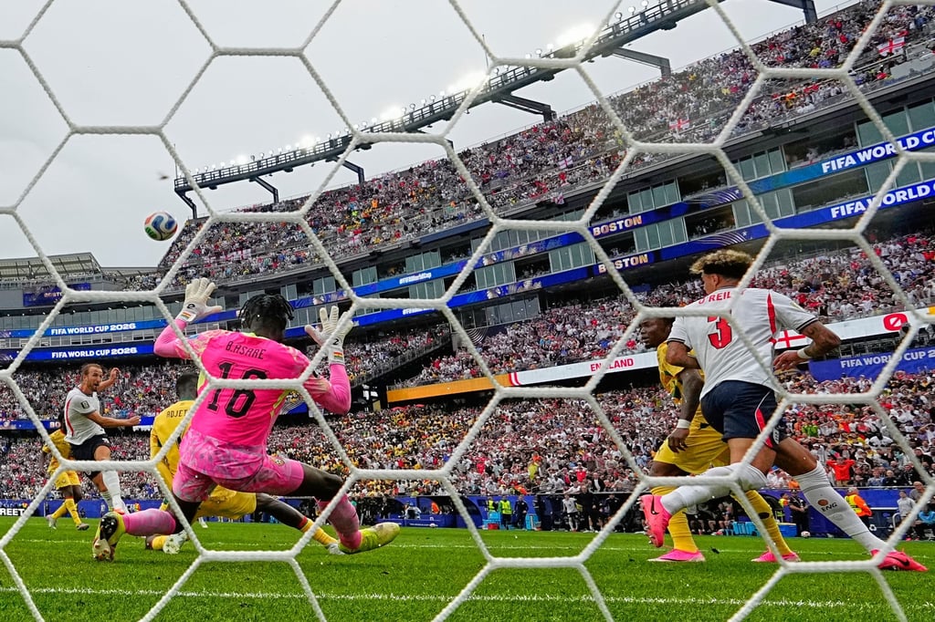 England's Harry Kane (left) kicks the ball over the goal. Photo: AP England's Harry Kane (left) kicks the ball over the goal. Photo: AP