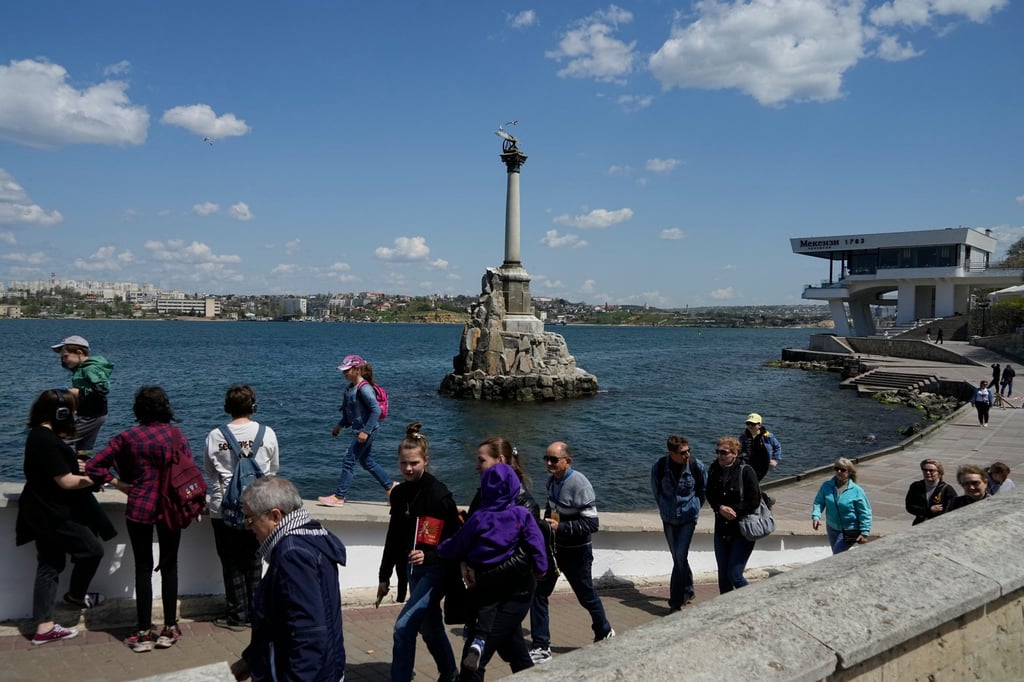 Tourists walk along an embankment in Sevastopol, Crimea, in 2022. Photo: AP Tourists walk along an embankment in Sevastopol, Crimea, in 2022. Photo: AP