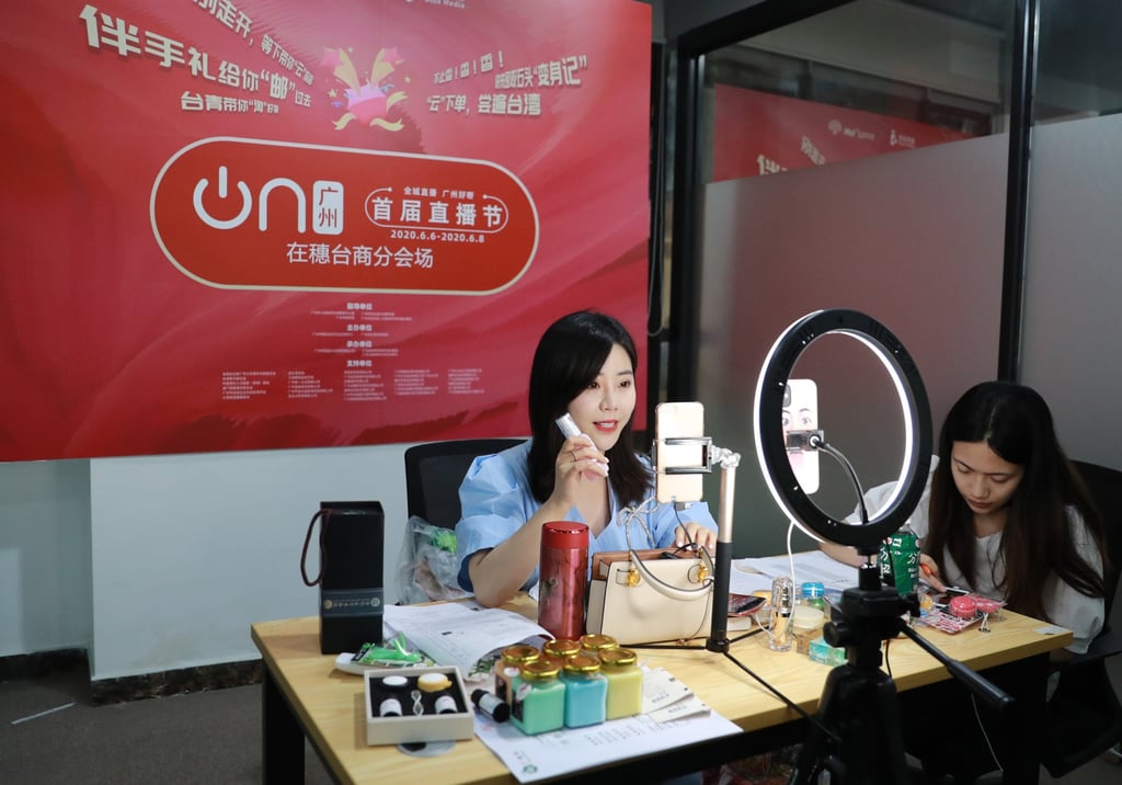 A network anchor presents goods to be sold during a live video stream in Guangzhou, south China. The Chinese app ecosystem has large audiences and a range of e-commerce services. Photo: Xinhua/Lu Ye