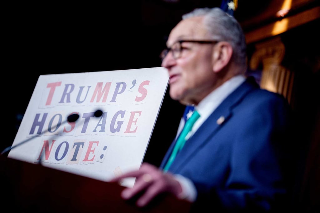 Senate Democratic Leader Chuck Schumer stands next to a poster that reads “Trump Hostage Note” as he speaks during a news conference on Capitol Hill on June 17. Photo: AP Senate Democratic Leader Chuck Schumer stands next to a poster that reads “Trump Hostage Note” as he speaks during a news conference on Capitol Hill on June 17. Photo: AP