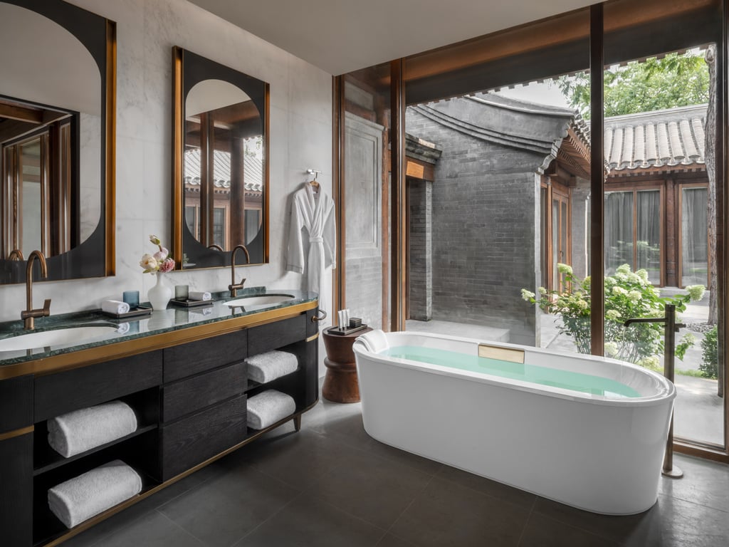 A bathroom looking onto a courtyard in one of the rooms. Photo: Handout