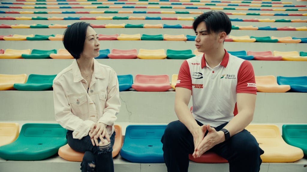 Betty Fung (left), a French cuisine and pastry chef, and Macau racing driver Charles Leong discuss the relationship between sports and food at the city’s Coloane Karting Track.