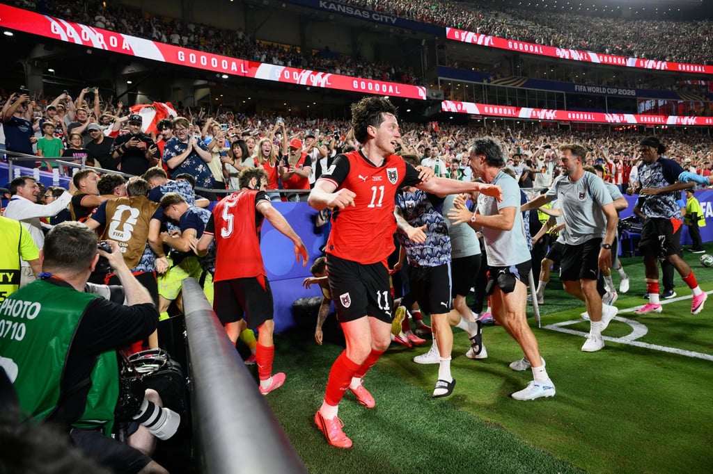 Austria’s players celebrate after Sasa Kalajdzic dramatic equaliser. Photo: AP