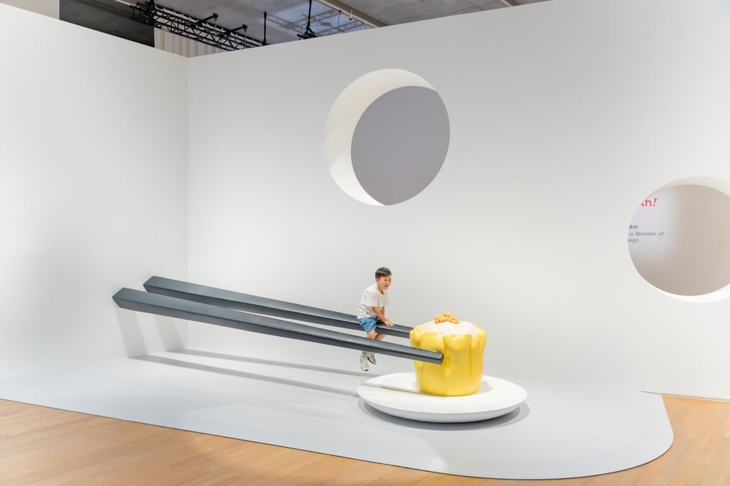 A visitor plays on an installation in the exhibition’s “In the Mood for Being Food” section. Photo: M+/Dan Leung