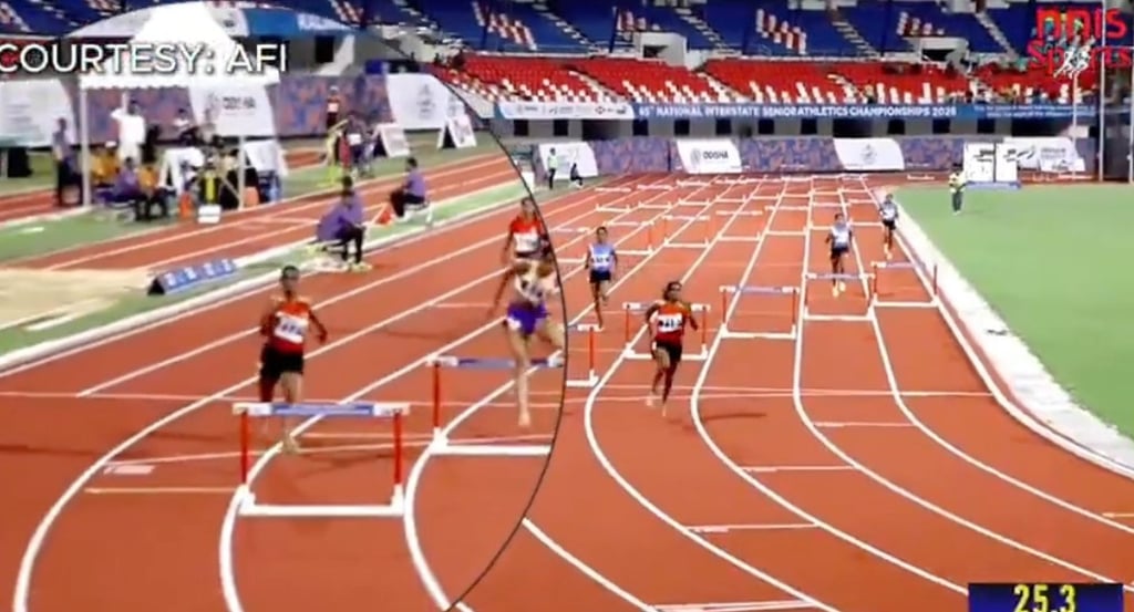 Harshita R (left) running into the next lane because the hurdle was missing from hers. Photo: Screenshot from video