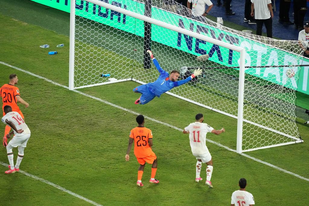 Morocco’s Issa Diop (14) heads the late equaliser past Netherlands goalkeeper Bart Verbruggen. Photo: AP Morocco’s Issa Diop (14) heads the late equaliser past Netherlands goalkeeper Bart Verbruggen. Photo: AP