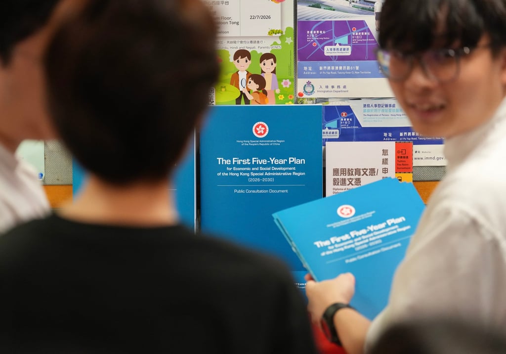 People collect copies of the consultation document for Hong Kong’s first five-year blueprint at the Wan Chai district Office on June 15. Photo: Karma Lo People collect copies of the consultation document for Hong Kong’s first five-year blueprint at the Wan Chai district Office on June 15. Photo: Karma Lo