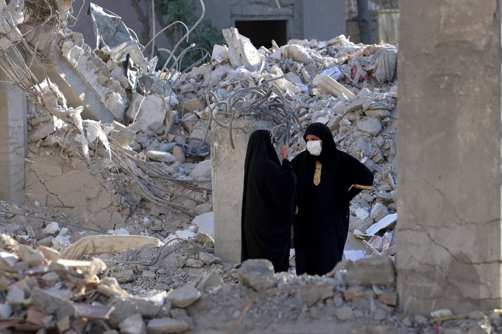 Iranian women chat in early June among the debris of a residential building destroyed by US-Israeli airstrikes. Photo: EPA Iranian women chat in early June among the debris of a residential building destroyed by US-Israeli airstrikes. Photo: EPA