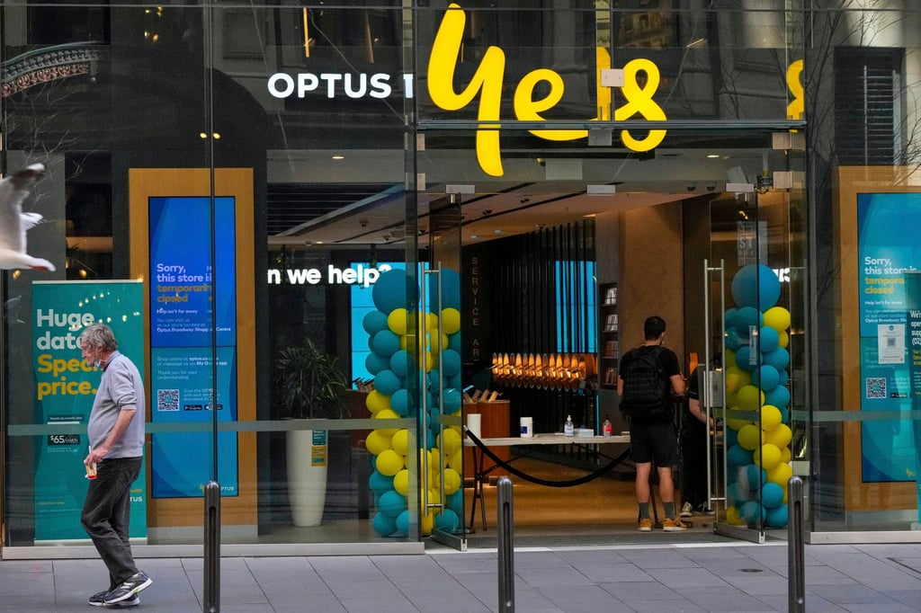 A customer waits for service at an Optus store in Sydney, Australia. Optus is a subsidiary of Singtel. Photo: AP A customer waits for service at an Optus store in Sydney, Australia. Optus is a subsidiary of Singtel. Photo: AP