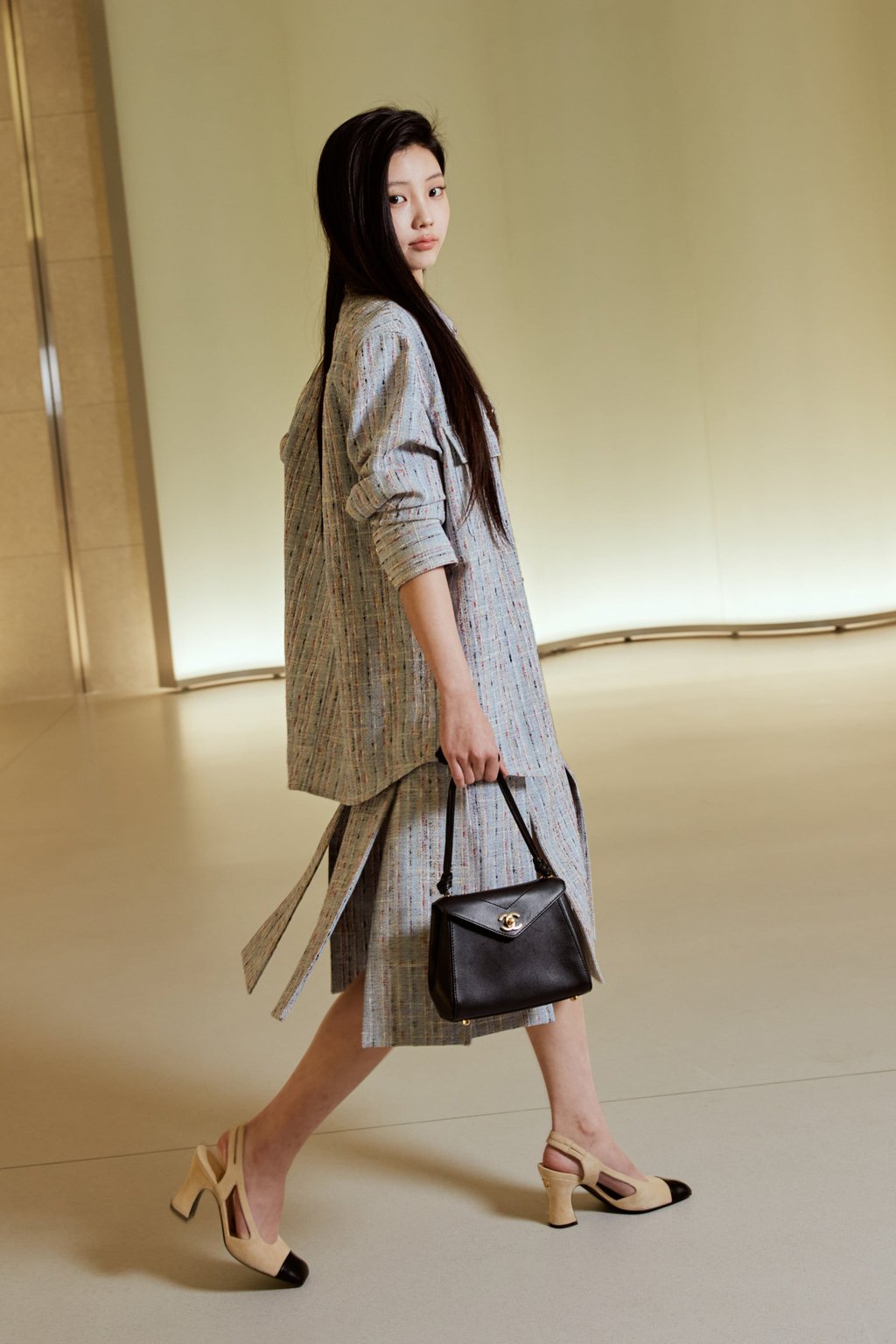 Wonhee of K-pop group Illit at the Chanel Métiers d’Art replica show in Seoul with a new signature envelope flap bag with a CC turnlock. Photo: Handout